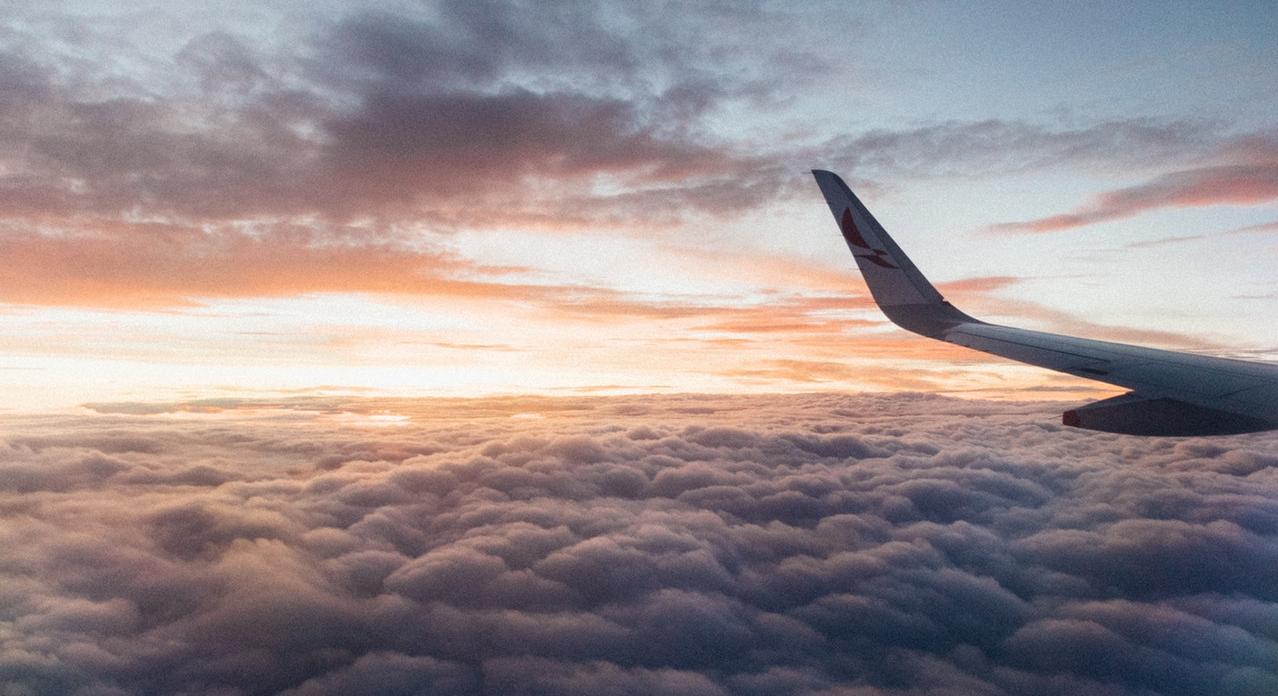 airplane wing and sunset