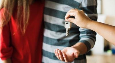 couple being handed house keys